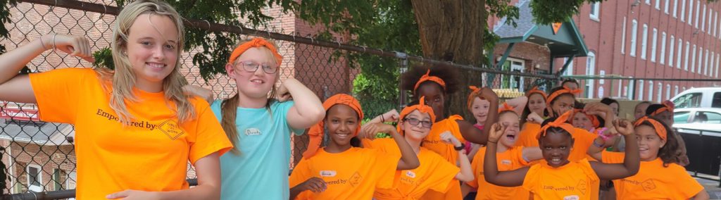 Group of girls with orange shirts